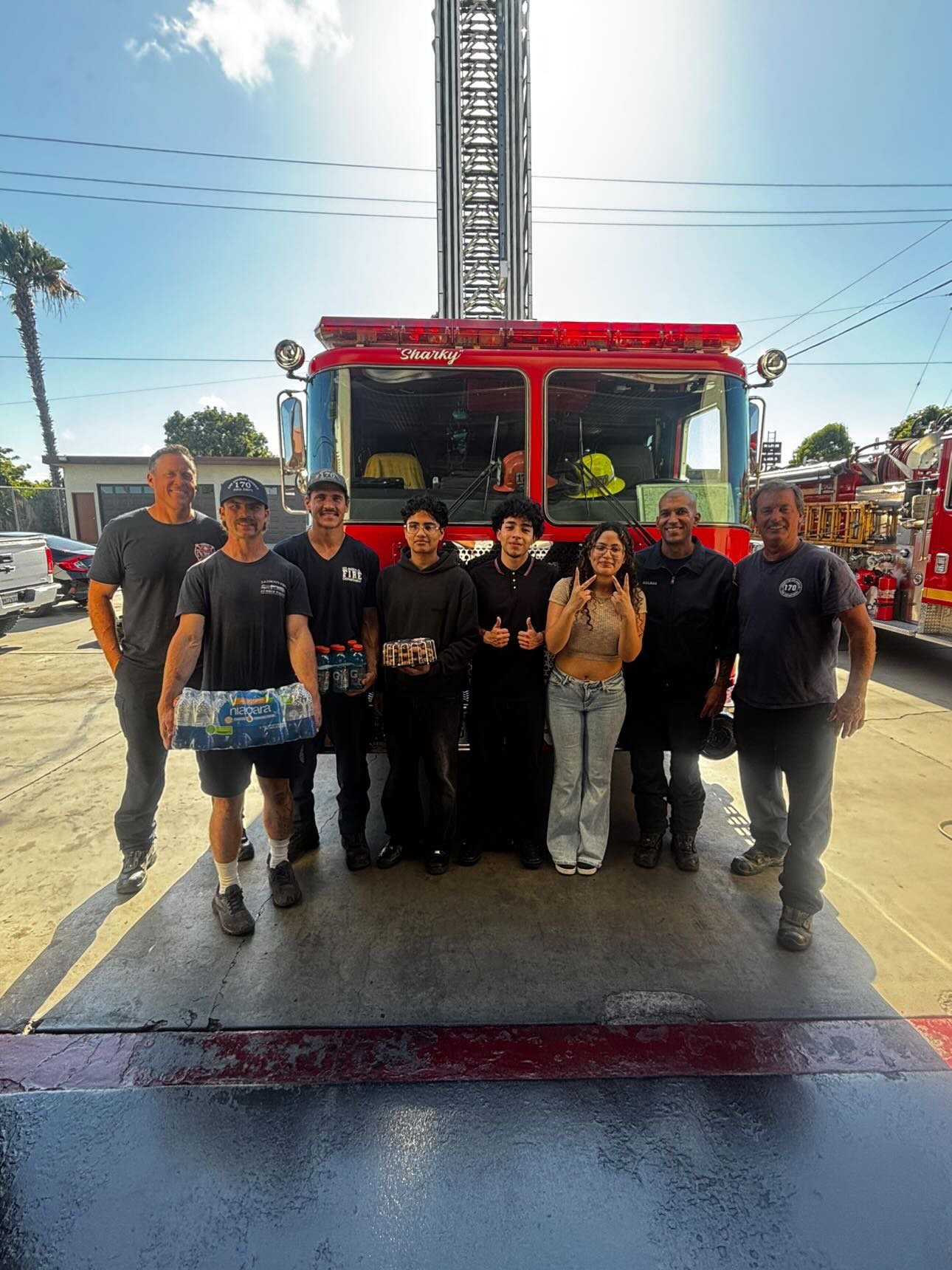 Project Pulmonary students and firefighters with the Sharky ladder truck