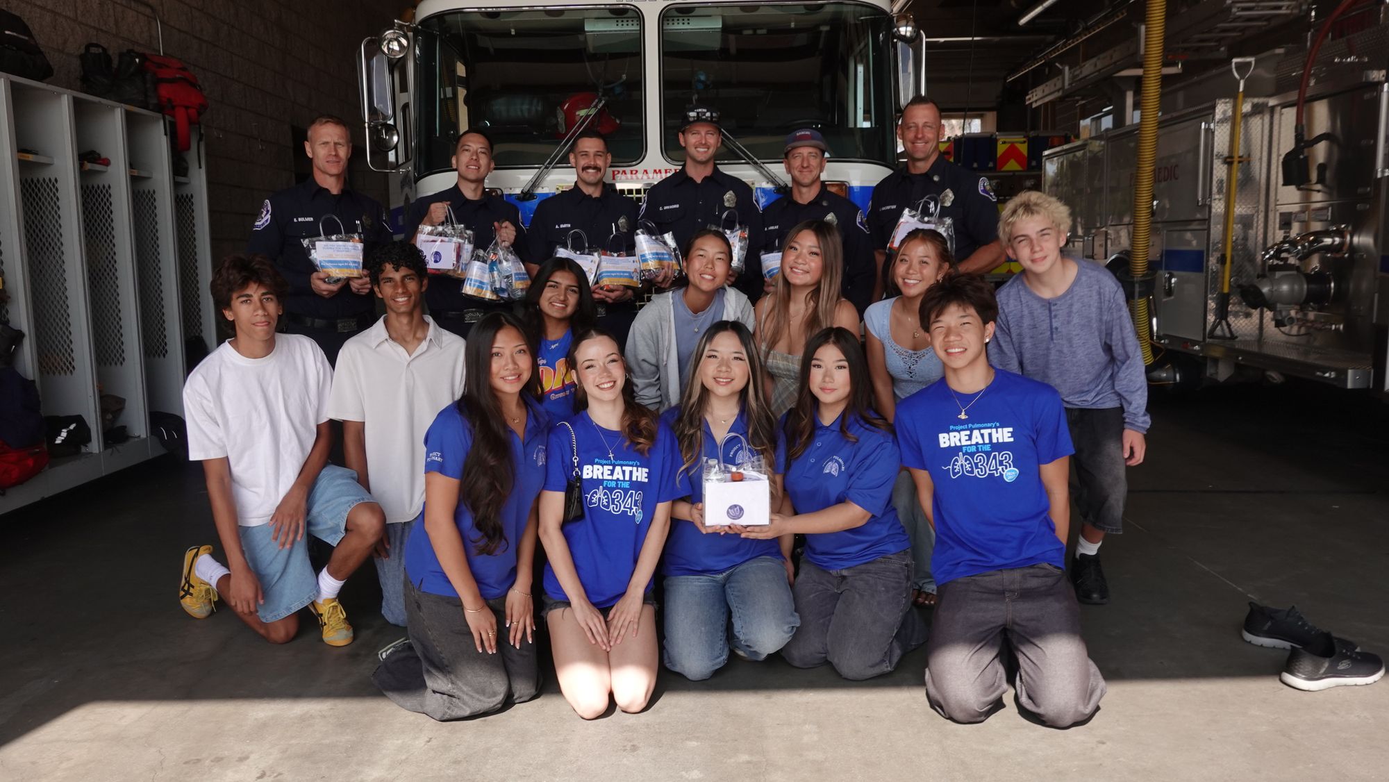 A large chapter of students with a full fire crew