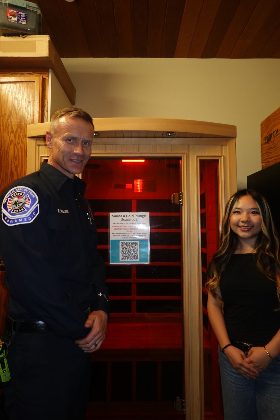 A firefighter beside an installed detoxification sauna