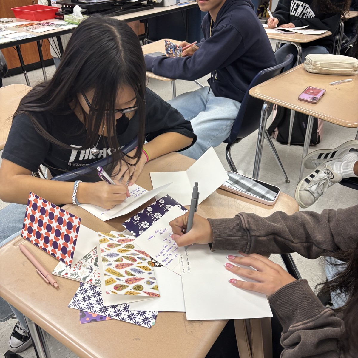 Students writing Letters for Lungs cards in a classroom