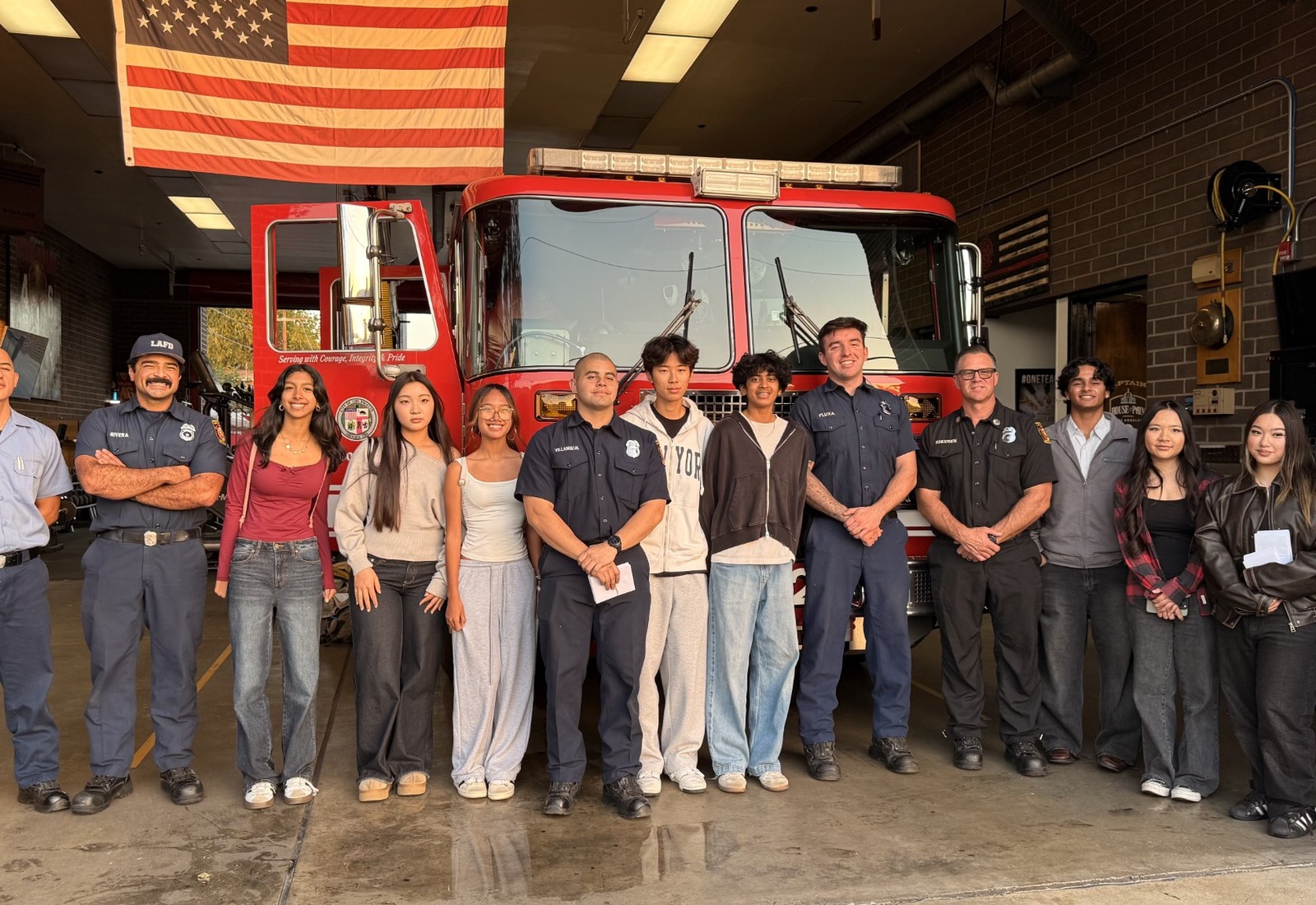 Project Pulmonary team and firefighters standing in front of a fire truck